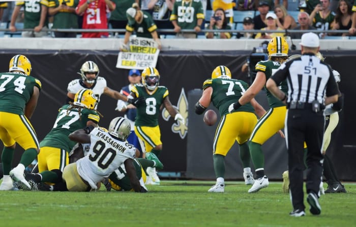 Saints defensive end Tanoh Kpassagnon (90) causes a fourth quarter fumble by Green Bay Packers quarterback Jordan Love (10). © Bob Self/Florida Times-Union via Imagn Content Services, LLC
